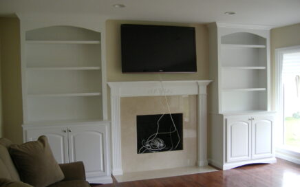 custom built in storage and fireplace mantle